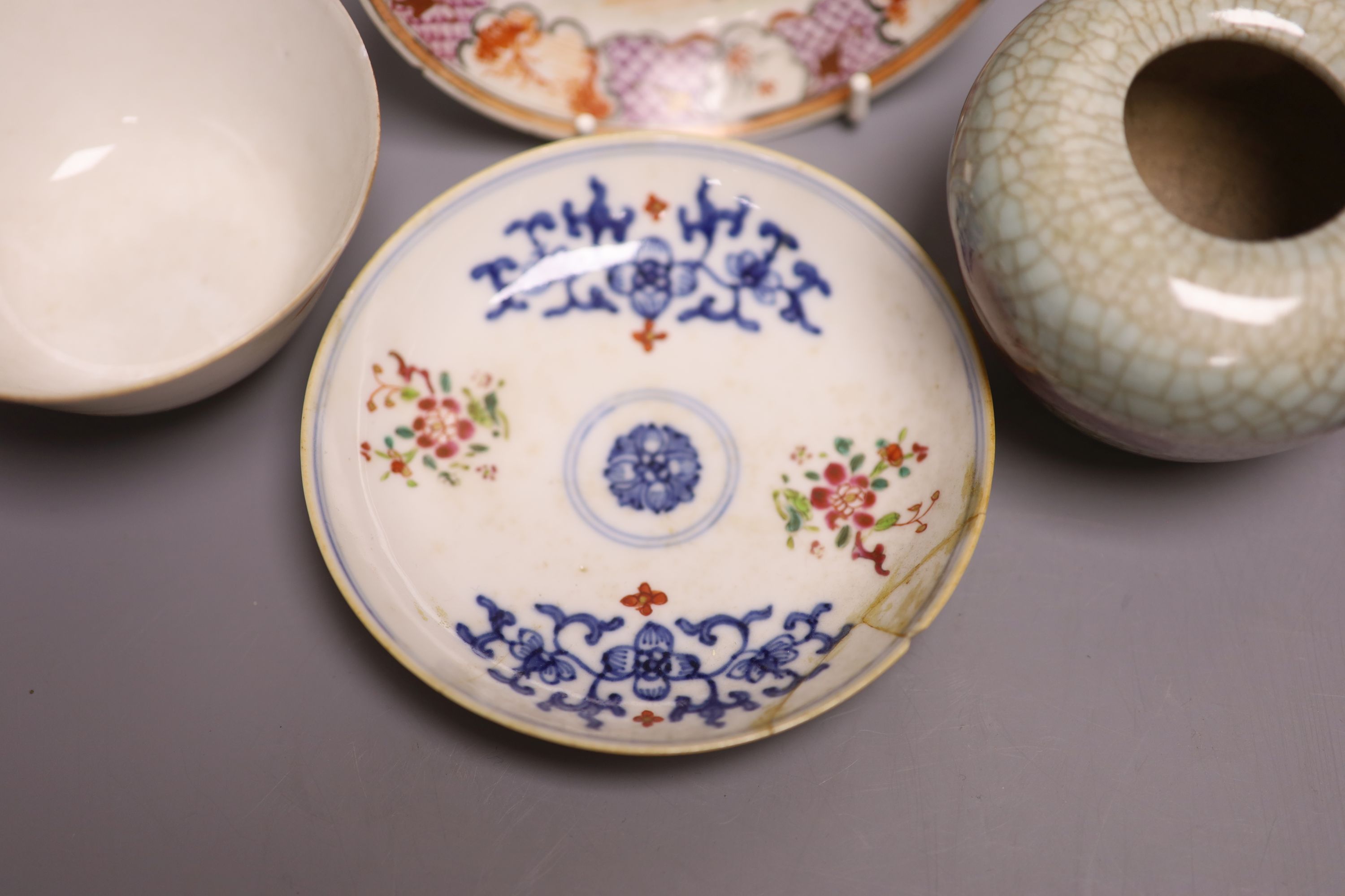 A pair of Chinese famille rose saucers, another saucer, three various tea bowls and a crackleglaze vase (7)